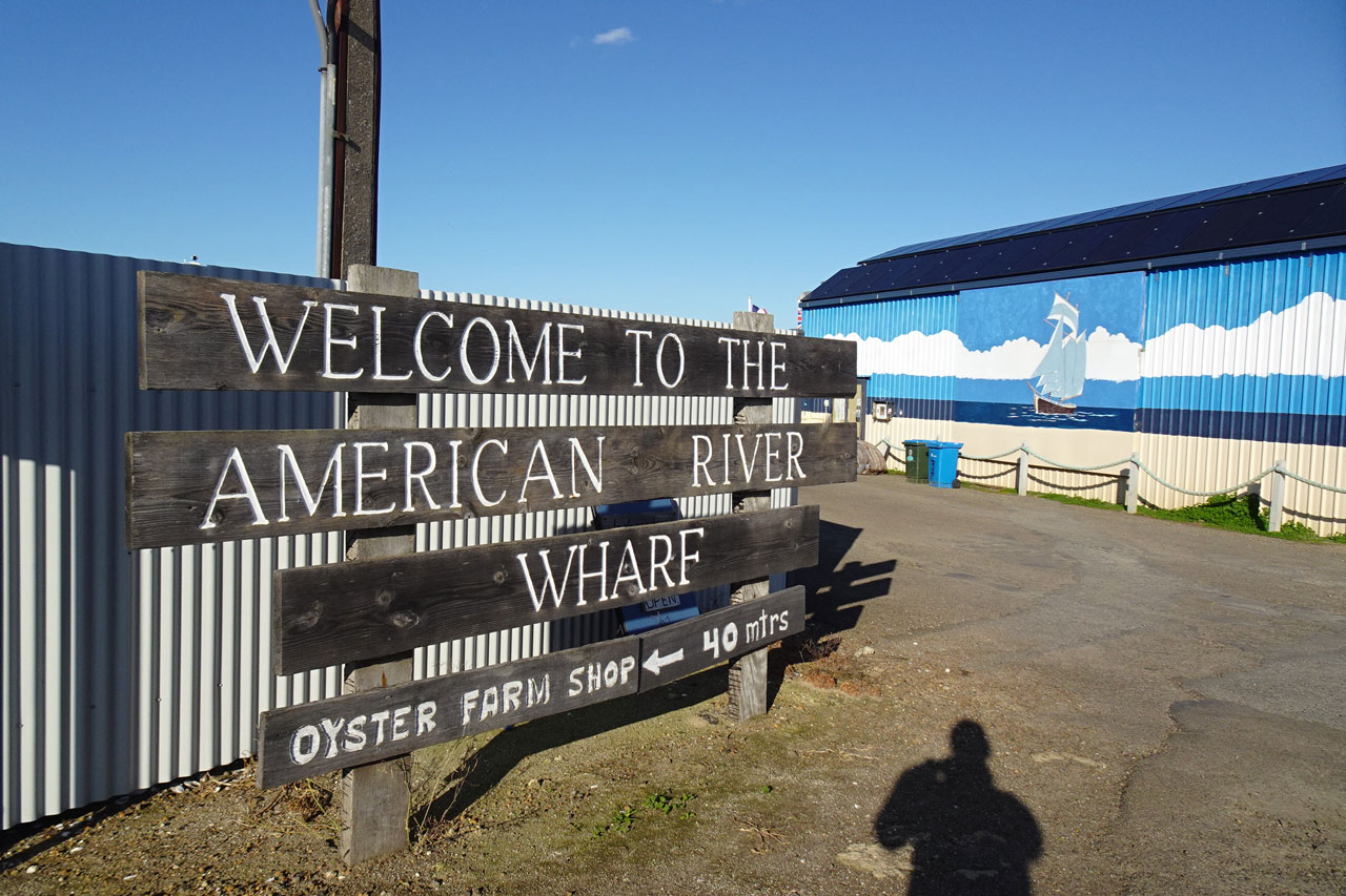 Wooden signage welcoming visitors to American Wharf