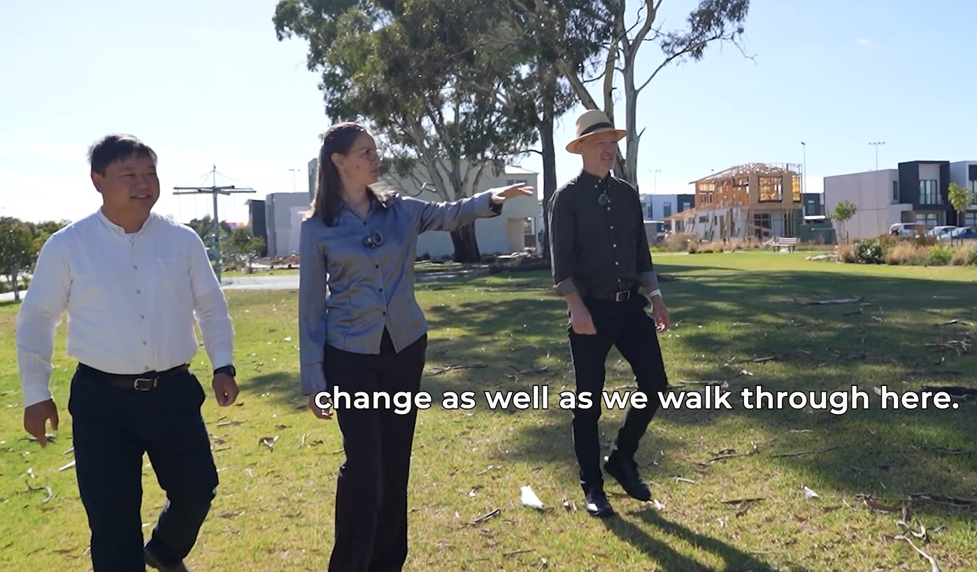 Michael, Nina and Chao walking through the open space
