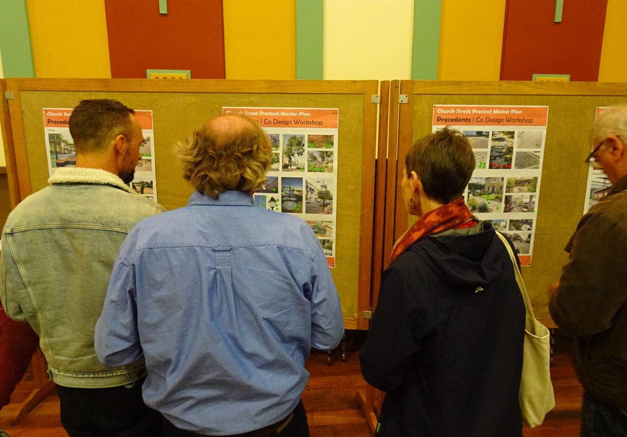 People looking at information on boards